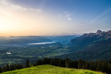 evening in switzerland with scenic view over lake in the alps