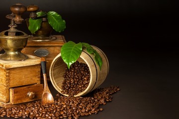 Coffee beans and a wooden grinder. Old coffee grinders. Healthy drink. Healthy drink. Grinding coffee.