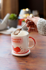 cup of chamomile, woman drinking cup of tea or coffee on wooden background