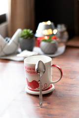cup of chamomile, woman drinking cup of tea or coffee on wooden background