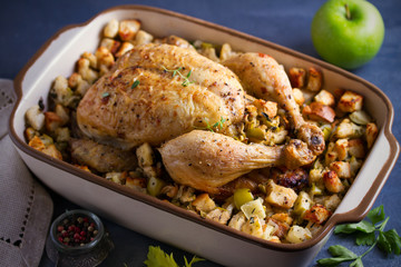 Roasted chicken with apple, bread and celery  stuffing. horizontal image