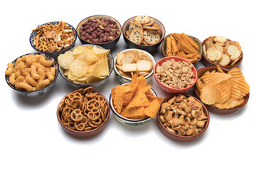 Salty snacks isolated on white
