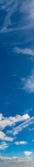 Fantastic clouds against blue sky, panorama