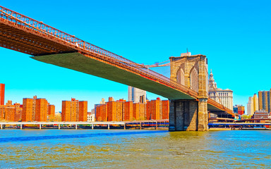 Brooklyn bridge across East River, New York, USA. It is among the oldest in the United States of...