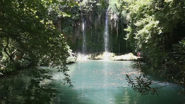 Kursunlu Falls falling in lake with turquoise water