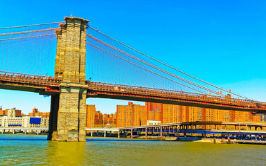 Brooklyn bridge across East River, New York, USA. It is among the oldest in the United States of...