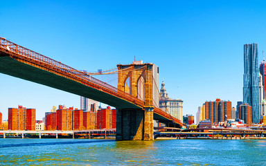 Brooklyn bridge across East River, New York, USA. It is among the oldest in the United States of...