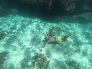 Diver in the sea of mallorca concept of summer beach and holiday 