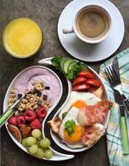 Colorful, healthy and tasty breakfast ingredients  on wooden table