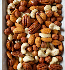 mixed nuts on wooden surface