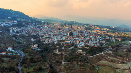 Aerial panorama of old village Pano Lefkara. Famous landmark of valley Pano Lefkara village, Larnaca, orange ceramic tiled house roofs. Travel to Cyprus.