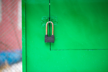 Iron lock on the green iron door