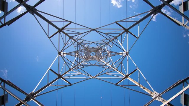 Looking straight up to electrical pylon from underneath, timelapse, low angle