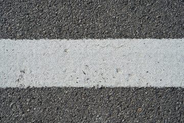 Closeup black rough asphalt road