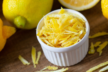 lemon zest on brown wooden surface