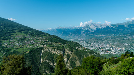 Fototapeta na wymiar Village of Vex, perched at the top of the cliff, and overlooking the Sion valley. Canton of Valais,
