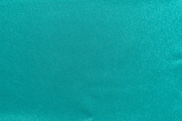 Rich matte even turquoise mint aqua smooth satin fabric. Abstract texture and background for design.