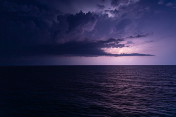 Fototapeta na wymiar Storm weather with lighting at open sea