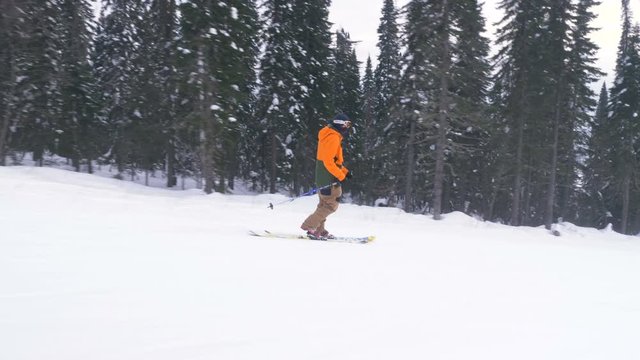 athlete skies along snowy track using technique of Telemark