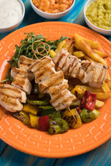 Grilled chicken meat on skewer
