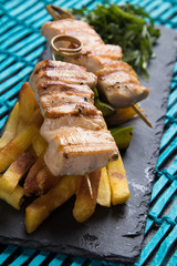 Grilled chicken meat on skewer