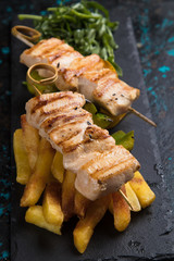 Grilled chicken meat on skewer