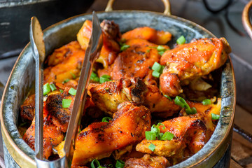 Traditional Brazilian food being prepared in clay pots and in the old and popular wood stove