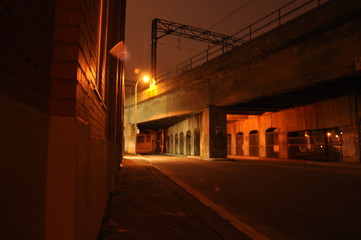 Fototapeta na wymiar View of road and train overpass at night