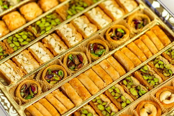 Oriental sweets in the box. Baklava with pistachios