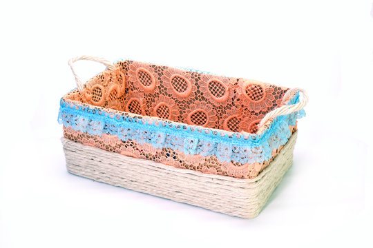Stationery basket Isolated on white background. Handmade craft recycle stationery basket box decoration with colorful embroidery and hemp rope.