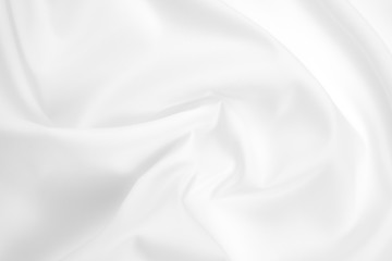 Obraz premium Abstract white fabric texture background. Cloth soft wave. Creases of satin, silk, and cotton. 