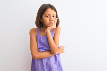 Young beautiful child girl wearing purple casual dress standing over isolated white background thinking looking tired and bored with depression problems with crossed arms.