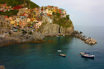 Fototapeta na wymiar Monterosso village of the Cinque Terre of Liguria with houses perched on the cliff