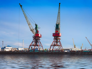 Port of a large Russian city with ships and various equipment on