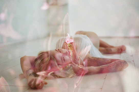 film double exposure of model in studio with flowers