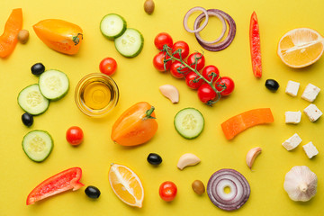 Ingredients for tasty Greek salad on color background