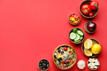 Ingredients for tasty Greek salad on color background