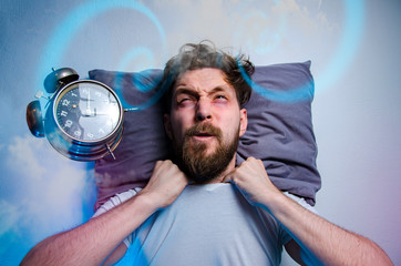 Mad man having trouble sleeping, insomnia concept, alarm clock flying in front of his head 