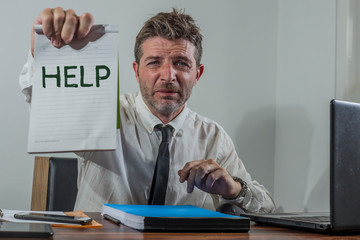 corporate business worker in stress -  attractive stressed and desperate businessman holding sign...