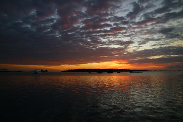 Naklejka na ściany i meble Scenic View Of Sea Against Sky During Sunset - stock photo