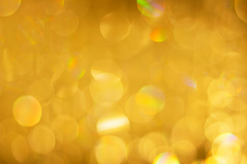 Beautiful gold color bokeh close-up, abstract background, festive concept