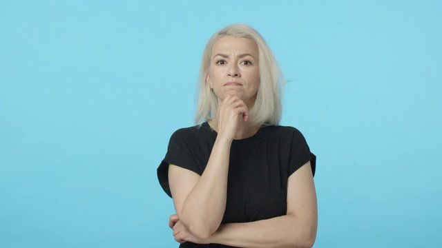 Wait sec, let me think. Slow-motion thoughtful blond woman, touch chin serious, making-up plan, thinking, got excellent idea gasping raise finger eureka gesture and touch temple, suggest resolve