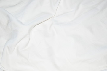 The surface of the bed sheet is crumpled.