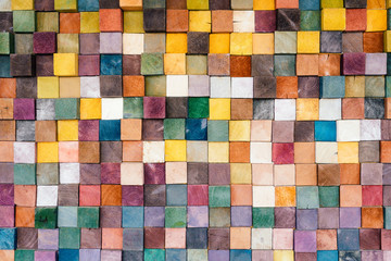 Colorful wood block stack on the wall, wooden blog square grid for decorate wallpaper,  texture background
