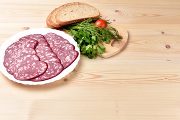 Sliced smoked sausage on a plate