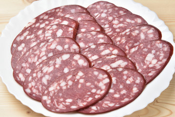 Sliced smoked sausage on a plate