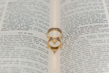 Wedding rings on a holy bible 