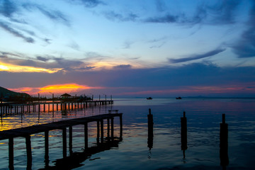 Fototapeta na wymiar Sunset on the bay near the pier