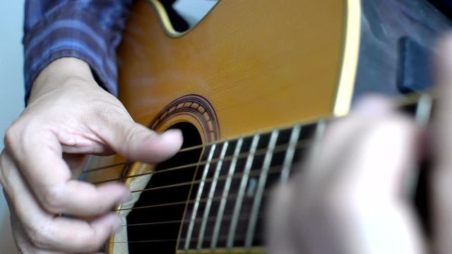 Play acoustic guitar