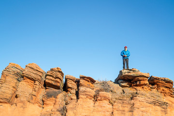 Male hiker on a sandstone cliff